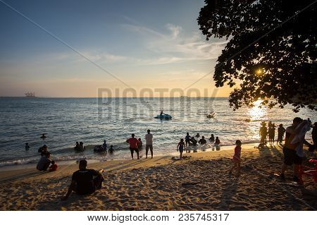 Lumut Perak, Malaysia - March 20, 2018: People Swimming At Beach Of Teluk Batik. Teluk Batik Beach I