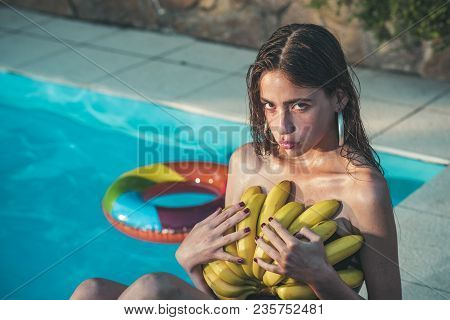 Summer Vacation And Travel To Ocean. Woman With Tropical Fruit In Pool. Vitamin In Banana At Girl Si