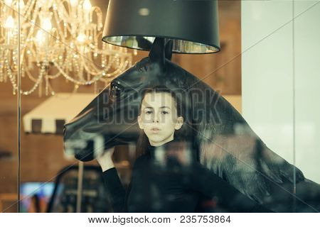 Girl Looks Sexi, Fashionable Indoors. Woman And Horse. Woman With Make Up And Serious Face. Sexy Gir