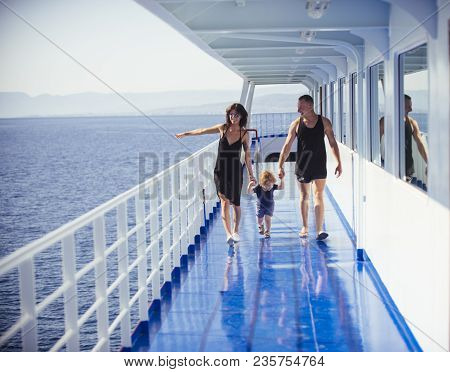 Happy Family With Cute Son On Summer Vacation. Family Travelling On Cruise Ship On Sunny Day. Family