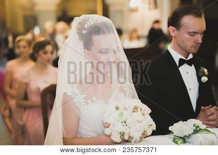 Wedding Couple Bide And Groom Get Married In A Church.