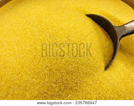 Pile Of Corn Flour With Metallic Scoop Close Up Shot