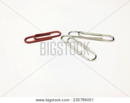 Paper Clip On The White Background-office Tool.