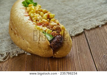 Texas Chili Dog -  Topped With Hearty Texas Chili, Freshly Grated Cheese And Chopped Sweet Onion.