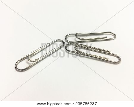 Office Tool. Paper Clip On The White Background-office Tool.