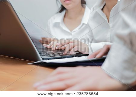 Cropped Image Of Hands Of Young Asian Business People Working Together On A Laptop Computer At Offic