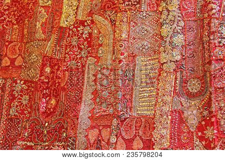Patchwork Of Indium. India Embroidery Colored Squares. Bright Multicolored Red Indian Oriental Backg