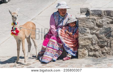 Arequipa, Peru - September 2017: Peruvian Woman With Lama And Alpaca.