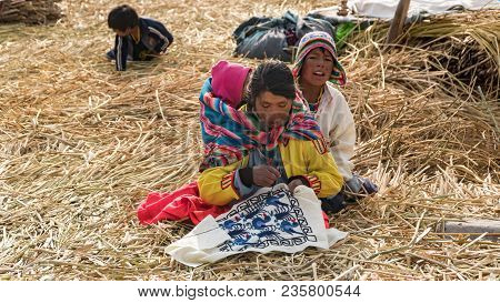 Puno, Peru - September 2017: Unidentified People At The Floating Island Isla Flotante, Titicaca Lake