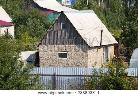 An Old House Stands On A Cottage Site .