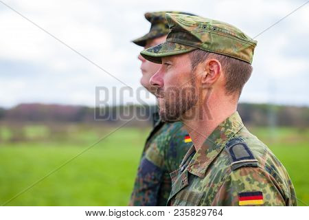 Two German Soldiers Looks To The Side