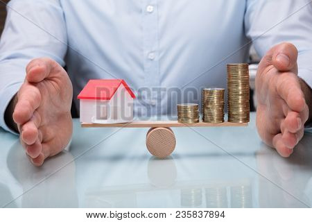 Protecting Balance Between House Model And Stacked Coins