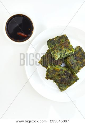 Top View Of Fried Chinese Pancake Or Fried Steamed Dumpling Made Of Garlic Chives, Rice Flour And Ta