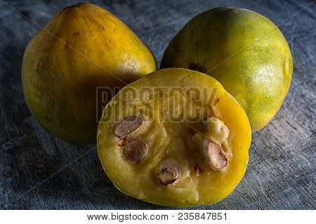 Araza Fruit From The Amazon Closeup On Rustic Background