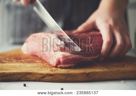 Wooman Hands Cutting Beef Meat On Wooden Chopping Board, Rosemary, Oil, Salt, Pepper. Girk Cooking P