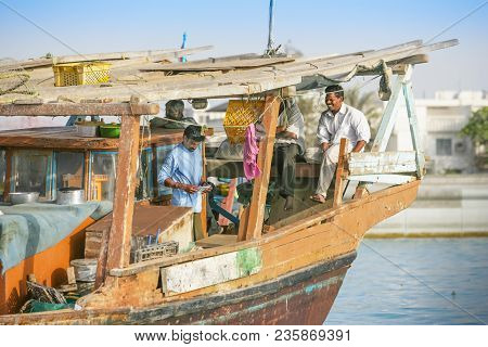 Abu Dhabi, Uae - March 27, 2005: Unidentified Crewmen Relaxing Aboard A Traditional Wooden Fishing D