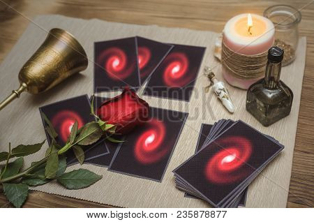 Tarot Cards On Fortune Desk Table, Empty Wine Goblet And Red Rose Flower. Future Reading Concept.
