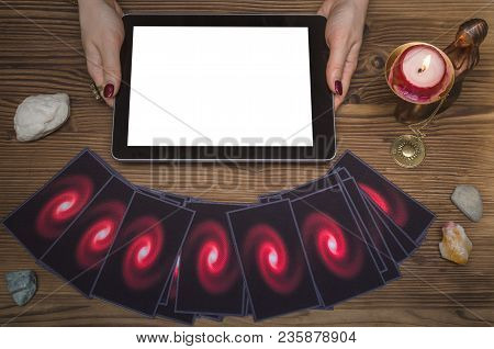 Online Future Reading Concept. Tarot Cards And Tablet Computer With Blank Screen On Fortune Teller D