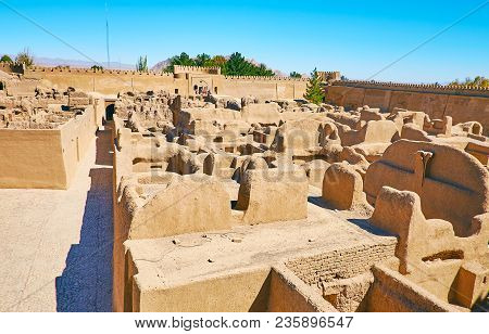 The Ruins Of Medieval Adobe Town, Surrounded By Tall Ramparts Of Rayen Fortress, Iran.