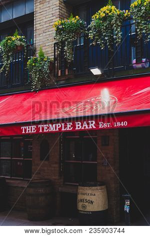 Dublin, Ireland - April 12th, 2018: The Temple Bar Pub In Dublin, Arguably The Most Popular Traditio