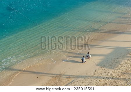 Several People On The Beach Of Kouki In Nago On Okinawa Island In Japan. Beautiful Turquoise Water C