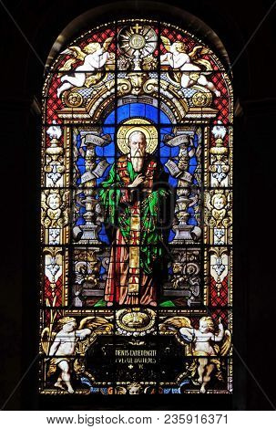 PARIS, FRANCE - JANUARY 09: Saint Dionysius the Areopagite, stained glass window in the Saint Roch Church, Paris, France on January 09, 2018.