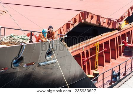 Sault Ste. Marie, Michigan/usa - June 26th, 2013: Two Shipmen Aboard A Freight Boat Passing Through 