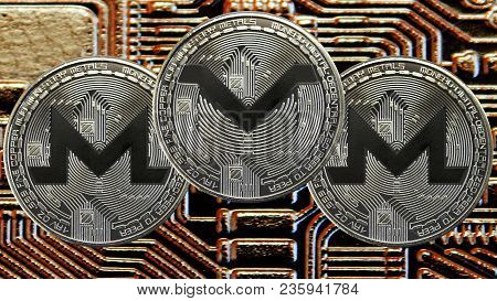 Silver Coins Cryptocurrency Monero And Monerov On Gold Cicuit Background. Xmv And Xmr Currency.