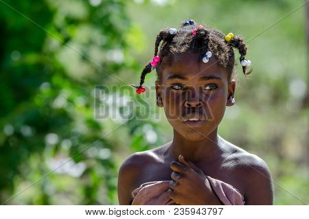 Higuey, Dominican Republic - October 29, 2015: Portrait Of Serious Unidentified Dominican Girl Outdo