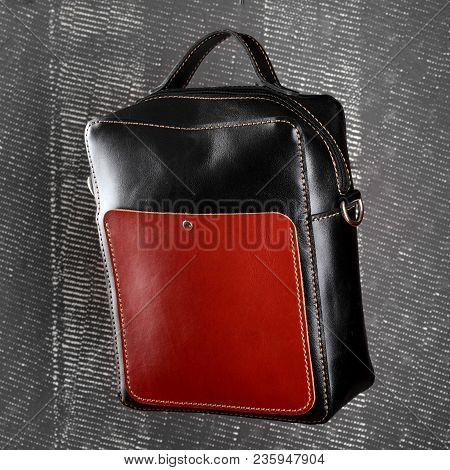 Messenger Bag .leather Black And Red Handmade Bag On Gray Background.