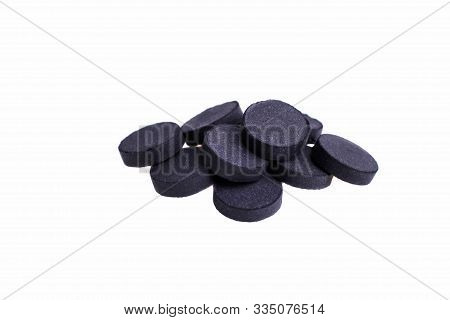 Activated Carbon Tablets Isolated On A White Background.