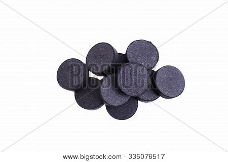 Activated Carbon Tablets Isolated On A White Background.