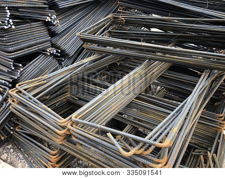 Piled Iron Reinforcement Workpieces. Bent Metal Parts For Reinforcement