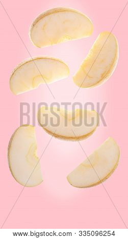 Yellow Apple Sliced Falling Down(chantecler, Chanteclerc, Malus Domestica). Variety Mix Of Golden De