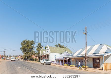 Machadodorp, South Africa - May 22, 2019: A Street Scene, With Businesses And Vehicles, In Machadodo
