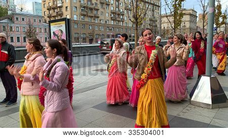 Moscow, Russia - November 12, 2019: Hari Krishna People, Women In Colorful Sari Walk Along The Stree