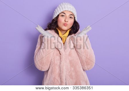 Eco Friendly Lover Of Animals Raising Hands, Putting Lips Together, Wearing Pink Fauxfur Coat, Yello