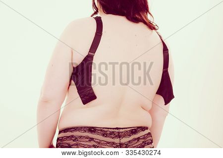 Woman Back View Putting On Her Bra Lingerie.