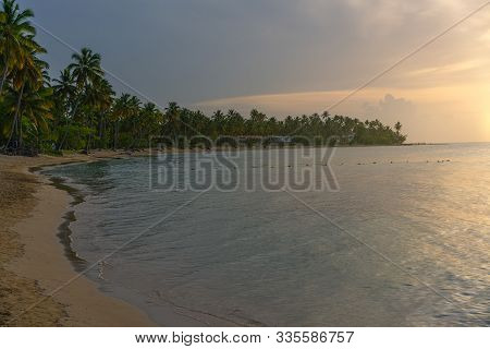 Beautiful Tropical Beach At Sunset, Bahia Principe Beach In El Portillo On The Samana Peninsula In T
