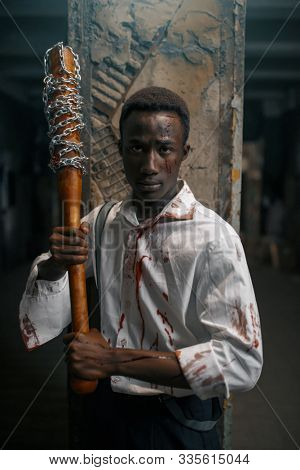 Man with baseball bat, deadly zombie chase