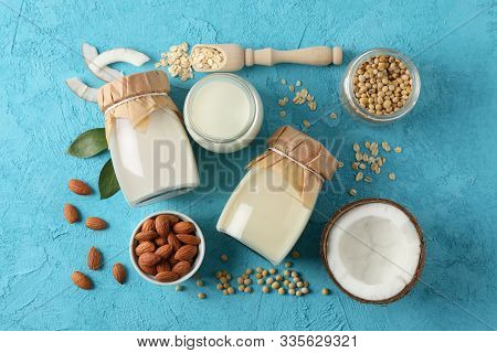 Composition With Different Types Milk, Coconut, Soybeat Seets, Almound, Oatmaet On Blue Background, 