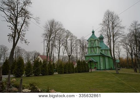 Beautiful Old Historic Historical Wooden Church On A Gray Autumn November Day, Poland