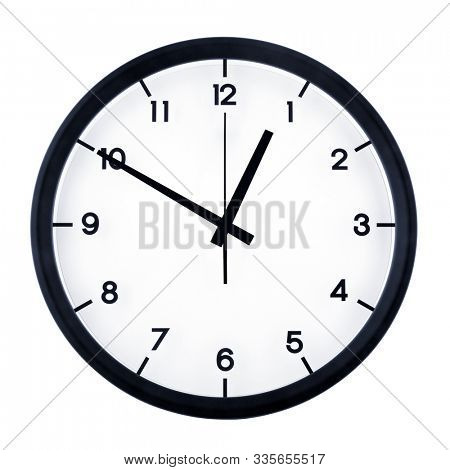 Classic analog clock pointing at twelve fifty, isolated on white background.