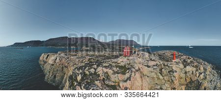 The Old Wooden Whale Watching Tower In Qeqertarsuaq, Greenland. Panorama Image. Qeqertarsuaq Is A Po