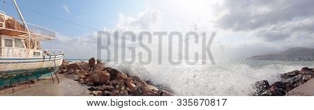 Old Broken Wooden Ship On The Seashore. Storm In Summer Day On A Mediterranean Sea.
