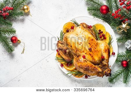 Chrismas Chicken Baked With Cranberry, Orange And Rosemary With Decoration Served Table. Christmas D
