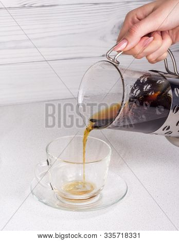 Ready Coffee Brewed In An Alternative Way In A Funnel V60 Is Poured Into A Cup With A Copy Of The Sp