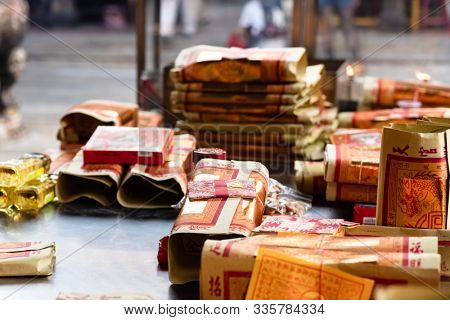 Yunlin, Taiwan - July 13th, 2019: chinese joss gold paper craft on a table at Beigang Chaotian Temple, Yunlin, Taiwan, Asia