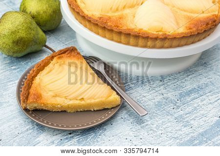 Delicious Home Bake Poached Pear Tart Pie, As Known As Tarte Bourdaloue, A Cup Of Coffee Latte. It I