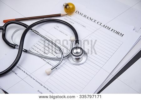 The Stethoscope Put On Blurred Insurance Claim Form,blurry Lihgt Design Background